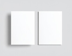 Blank folded paper mockup on gray background. Top view of empty white sheet template for flyer, brochure, invitation, or leaflet design. Minimal stationery concept with clean surface and soft shadows.