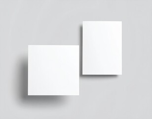 Blank folded paper mockup on gray background. Top view of empty white sheet template for flyer, brochure, invitation, or leaflet design. Minimal stationery concept with clean surface and soft shadows.