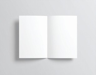 Blank folded paper mockup on gray background. Top view of empty white sheet template for flyer, brochure, invitation, or leaflet design. Minimal stationery concept with clean surface and soft shadows.