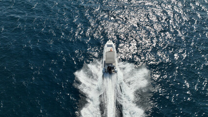 Aerial drone top down photo of  luxury inflatable rib speed boat cruising in mediterranean sea