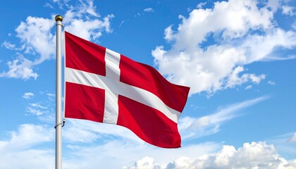 Danish national flag waving on a pole under a bright sunny sky with scattered clouds.