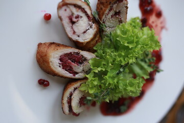 Delicious Stuffed Poultry with Berry Sauce and Fresh Green Salad