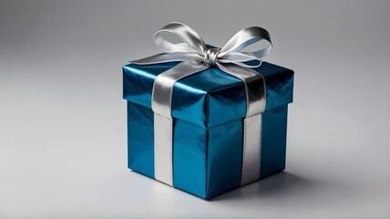 Obraz premium Elegant Teal Gift Box with Silver Ribbon Perfect for Special Occasions