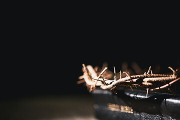 Closeup of Jesus Christ wearing crown of thorns during His crucifixion captures the suffering,...