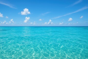 Obraz premium Azure Horizon: A tranquil seascape of the clear ocean under a vast azure sky, promising serenity and open space. 