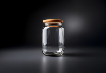 Empty glass jar with a wooden lid, isolated on a blackj background. Product mockup.