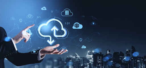 Cloud storage concept with digital data transfer icons and businessman interacting with futuristic interface above night cityscape background..