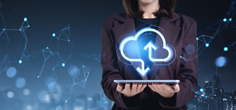 Businesswoman holding tablet with cloud storage interface on abs
