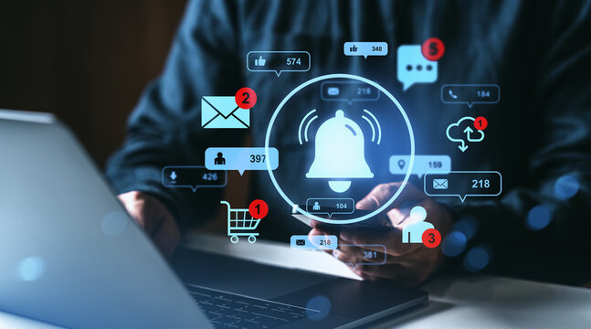 Digital notification icons emerging from smartphone and laptop interface in dark space.
