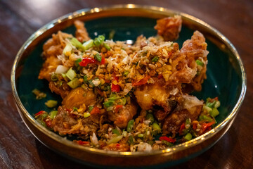 Stir Fried soft shell crab with salt and chili, served on plate