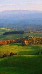Rolling Green Hills And Autumn Trees At Sunrise landscape