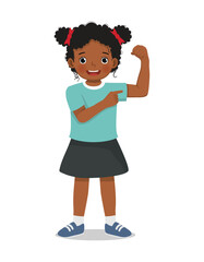 Little African girl showing her strong muscle arm fist
