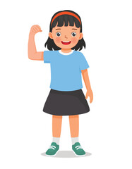 Little girl showing her strong muscle arm fist
