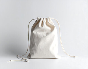White cotton drawstring pouch isolated on plain background