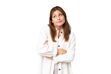 Middle age woman over isolated background making doubts gesture while lifting the shoulders