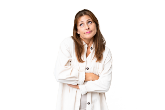 Middle age woman over isolated background making doubts gesture while lifting the shoulders