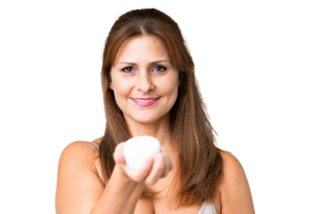 Middle age woman over isolated background with moisturizer and offering it