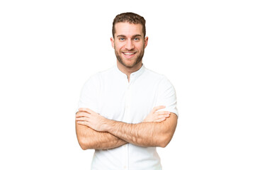 Young handsome blonde man over isolated chroma key background keeping the arms crossed in frontal...