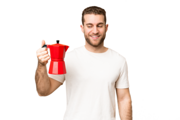 Young handsome blonde man holding coffee pot over isolated chroma key background with happy expression