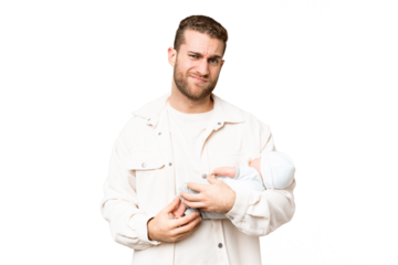 Young handsome blonde man with his newborn baby over isolated chroma key background with sad expression