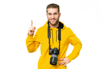 Young photographer man over isolated chroma key background showing and lifting a finger in sign of the best