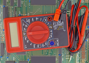 multimeter closeup and circuit board