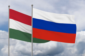 Russian and Hungary flag on sky background. 3D illustration
