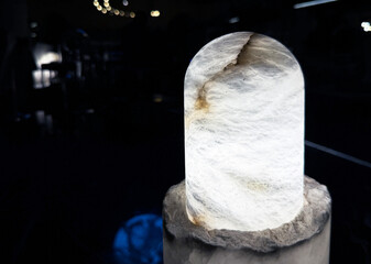 Natural solid stone table lamp in dark light.