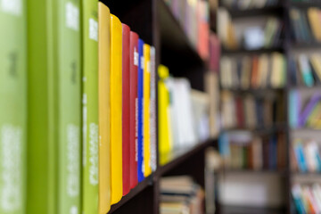 Various types of books on a library shelf