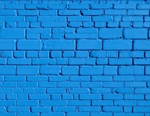 Obraz premium A vibrant, uniform wall of painted blue bricks