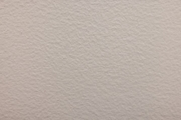Abstract close-up of a white textured wall with uneven surface