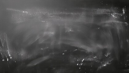 textured black chalkboard with white chalk smudges and dust streaks creating abstract minimal backdrop for banner design or editorial background