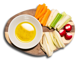 fresh vegetables and pinzimonio on a wooden cutting board