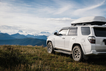 Driving off road car on the high altitude mountains