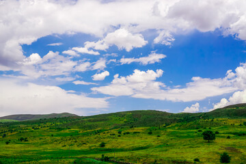 Fototapeta premium Beautiful Scenic Meadows and Fields on Erzurum Cat district in Turkey on a cloudy day