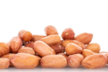 Peeled raw peanuts isolated on white background.