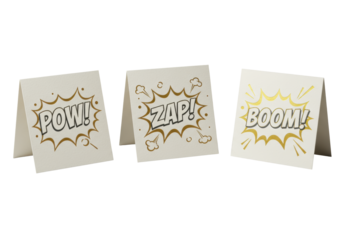 Three off-white die-cut stationery cards ('POW!', 'ZAP!', 'BOOM!') with metallic foil and comic shapes in a row on transparent, 45-degree studio shot, high-end comic stationery concept