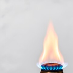Natural gas burner flame with blue and orange colors. Concept of gasification, safety, and energy. For home utility.