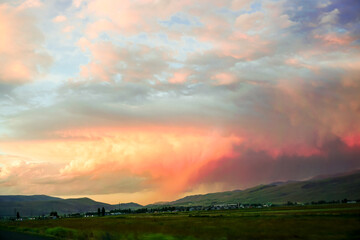 Cloudscape at Dusk in Erzurum Turkey on a cloudy day with green meadows and fields