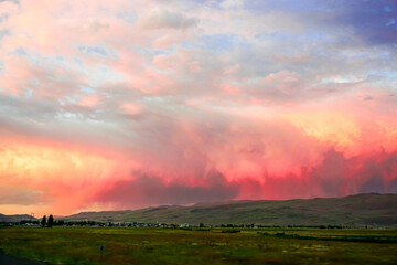 Cloudscape at Dusk in Erzurum Turkey on a cloudy day with green meadows and fields