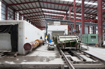 Manufacturing plant with heavy machinery for concrete tunnels covers