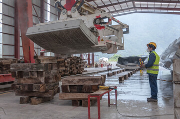 Naklejka premium Industrial workers in manufacturing plant with heavy machinery for concrete tunnels covers. Machine, concrete, factory, warehouse, construction, site, environment, engineering, teamwork, workplace