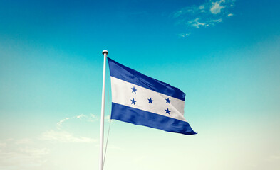 Honduras national flag waving in beautiful sky with mast. A proud moment flag waving with sunlight.