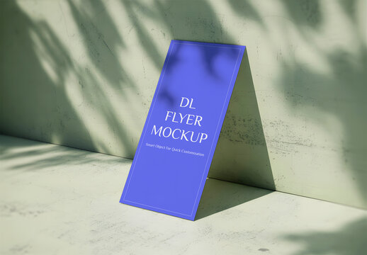 DL Flyer Mockup Leaning on a Wall with Realistic Leaf Shadow