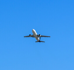 Twin engine commercial airplane taking off