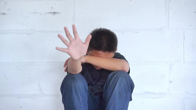 Stop abusing boy violence. child bondage , violence, terrified , A fearful child , Human Rights Day concept.