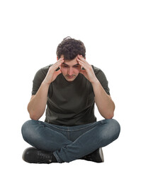 Upset and depressed young man sitting on the floor with hands pointed to forehead looking down thoughtful in sorrow, isolated on transparent background with copy space