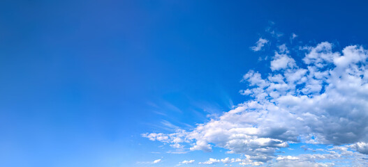 Wide detailed panorama of the sky with a large number of clouds. Spacious summer clear space with...
