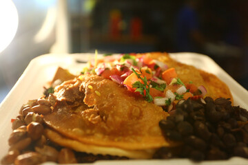 mexican food with tacos guacamole and nachos