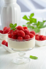 Panna cotta with fresh raspberries.
